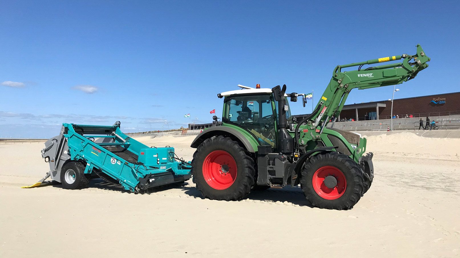 Towed Beach Cleaner BeachTech 2500 with tractor Side view on the beach 